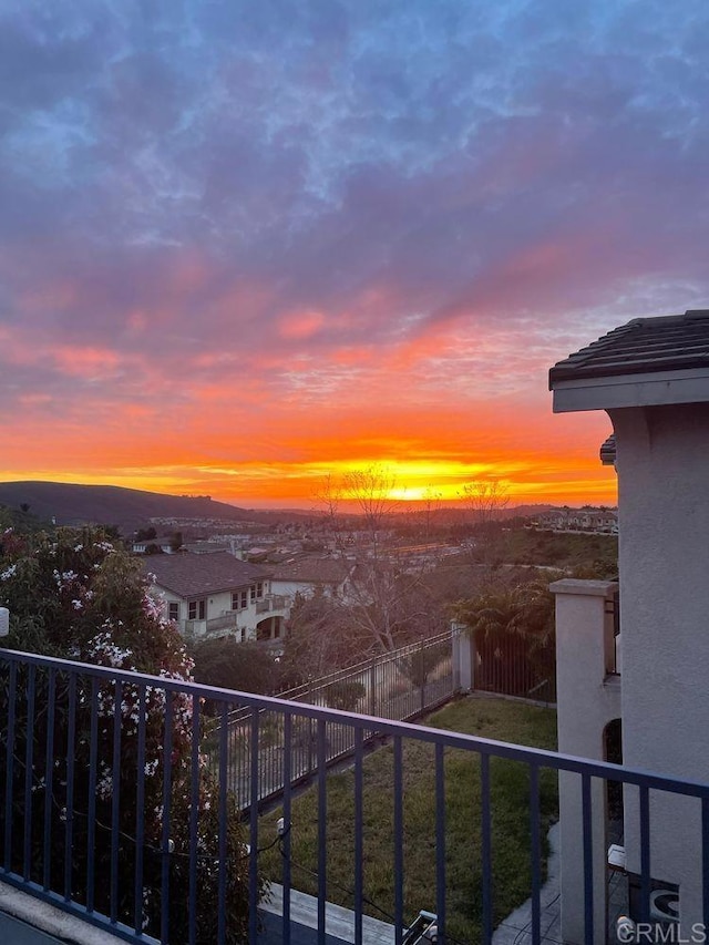 view of balcony at dusk