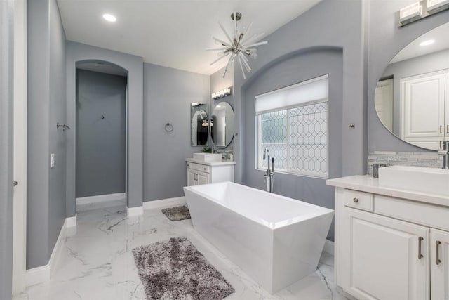 full bath featuring recessed lighting, marble finish floor, baseboards, and a sink