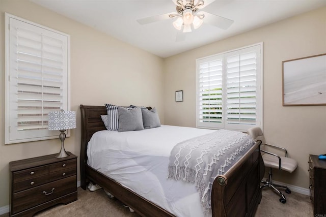 bedroom with baseboards, carpet floors, and a ceiling fan