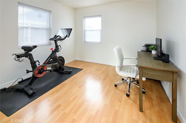 interior space featuring light wood-style floors and baseboards