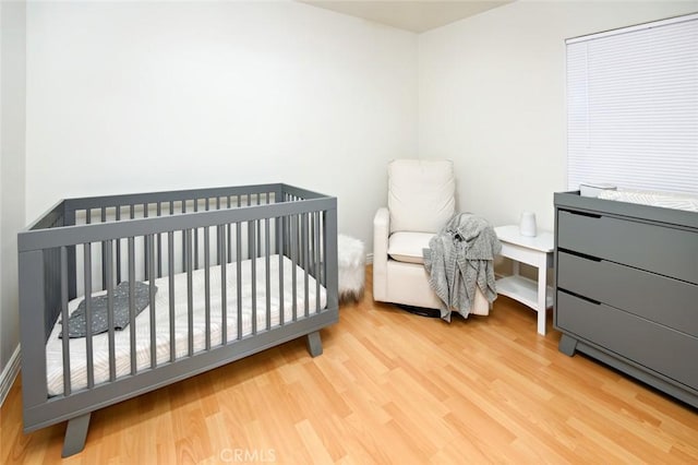 bedroom featuring wood finished floors