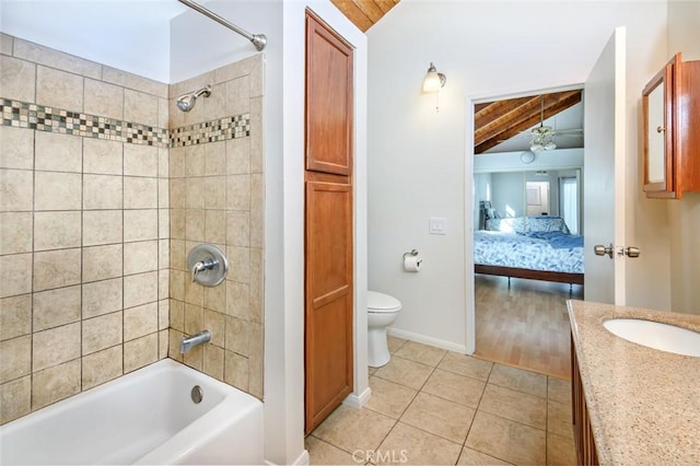 full bath with tile patterned floors, toilet, tub / shower combination, lofted ceiling, and vanity