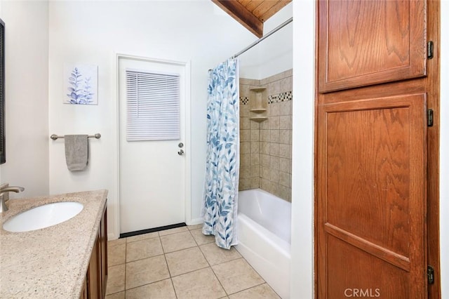 bathroom featuring tile patterned flooring, vanity, and shower / bath combo