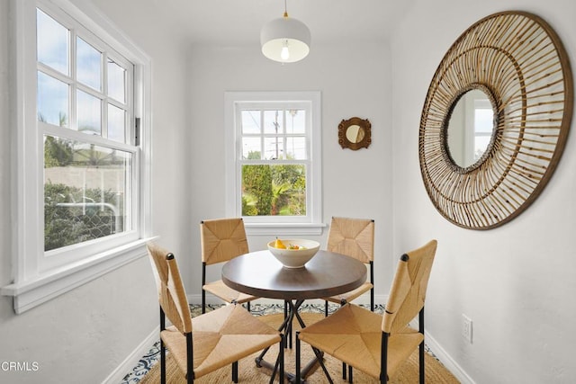 dining room with baseboards