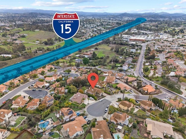 drone / aerial view with a mountain view and a residential view