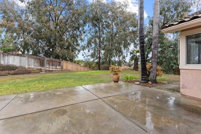 view of patio / terrace featuring fence