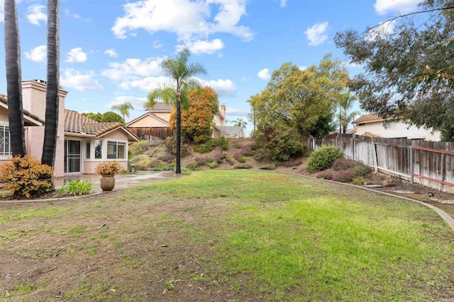 view of yard with a patio area and a fenced backyard