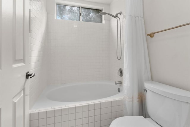 full bath featuring toilet and tiled shower / bath combo