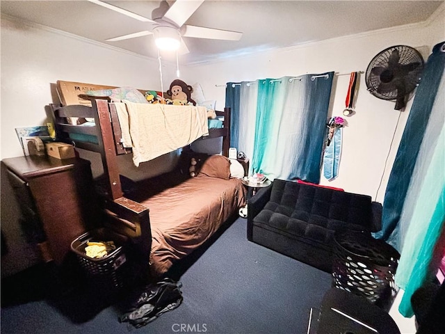 bedroom with a ceiling fan, crown molding, and carpet