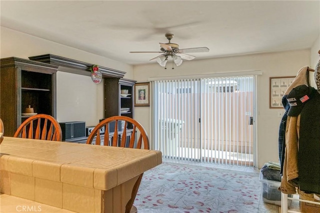 dining space with ceiling fan