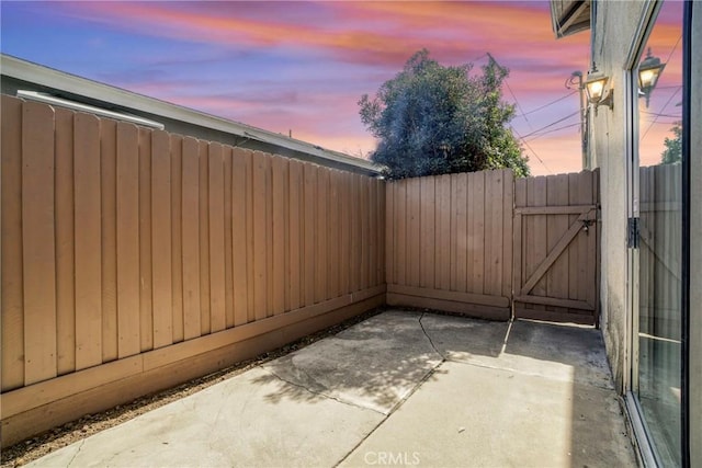 view of patio / terrace with a gate and fence