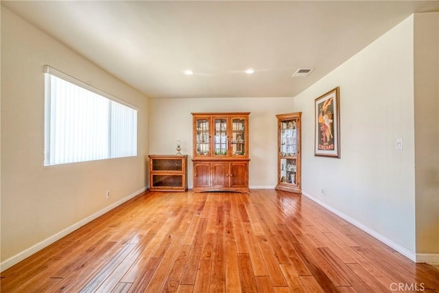 unfurnished room featuring recessed lighting, visible vents, baseboards, and light wood finished floors