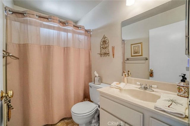 bathroom with toilet, vanity, and a shower with curtain