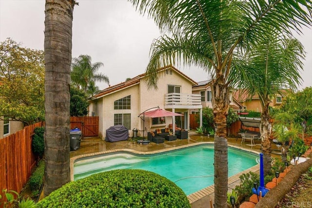 view of swimming pool with a patio area, a fenced in pool, and a fenced backyard