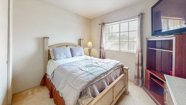 bedroom with light colored carpet