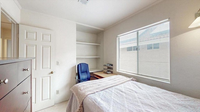 bedroom featuring crown molding and light colored carpet