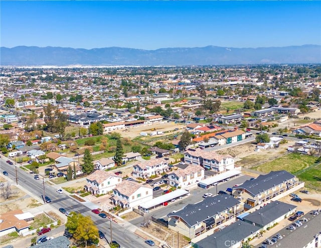 drone / aerial view featuring a mountain view and a residential view