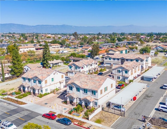 drone / aerial view featuring a mountain view and a residential view