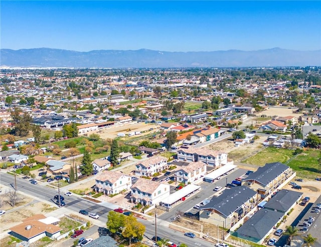 drone / aerial view featuring a mountain view and a residential view