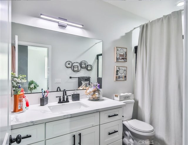 full bath featuring toilet and vanity