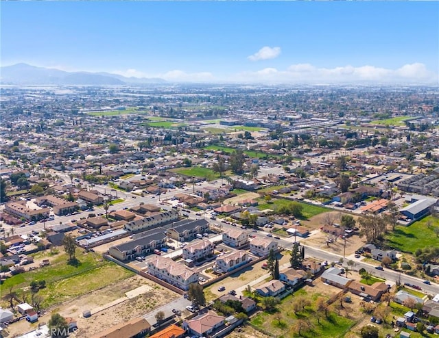 birds eye view of property with a mountain view