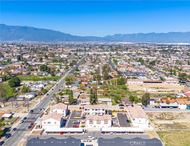 drone / aerial view featuring a residential view and a mountain view