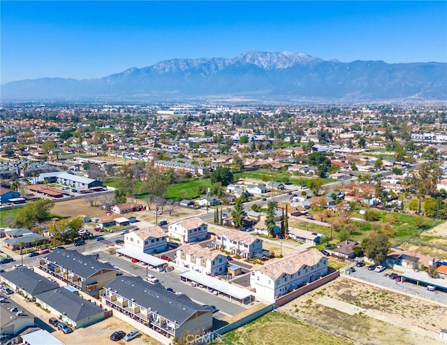 birds eye view of property with a mountain view