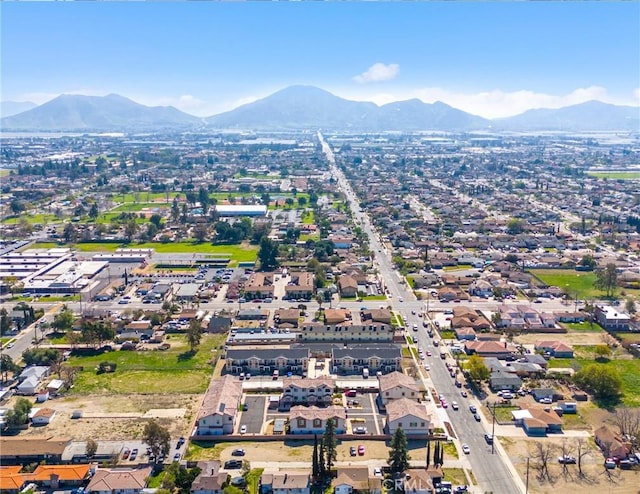 birds eye view of property featuring a mountain view