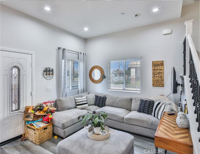 living area with recessed lighting and wood finished floors