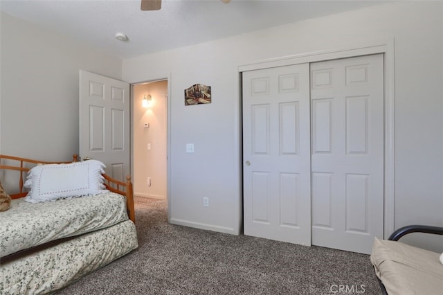 carpeted bedroom featuring a closet, ceiling fan, and baseboards