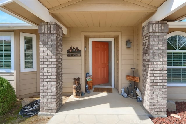 property entrance with brick siding