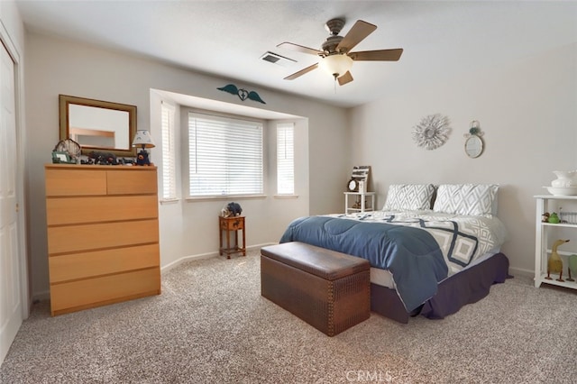 bedroom featuring visible vents, baseboards, and carpet flooring