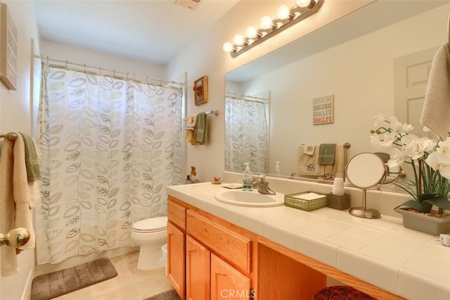 full bath with tile patterned floors, curtained shower, toilet, and vanity