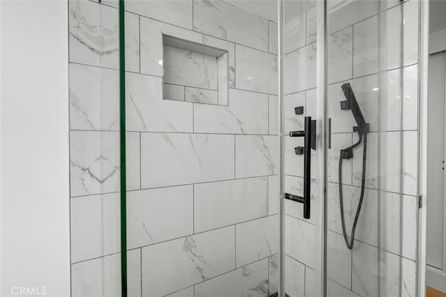 bathroom featuring a shower stall