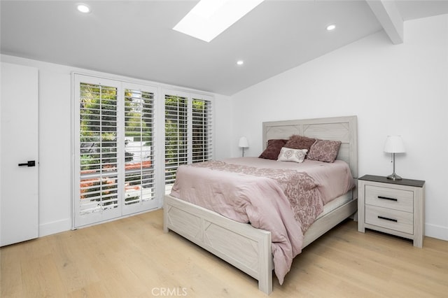 bedroom featuring lofted ceiling with skylight, recessed lighting, light wood-type flooring, and access to exterior