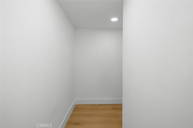 interior space with recessed lighting, baseboards, and wood finished floors