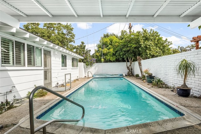 view of pool with a patio, a fenced backyard, and a fenced in pool