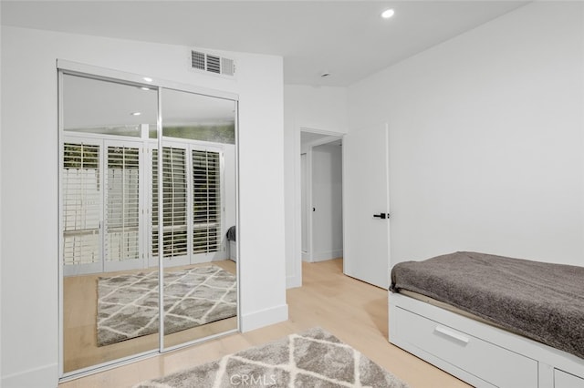 bedroom featuring recessed lighting, wood finished floors, and visible vents