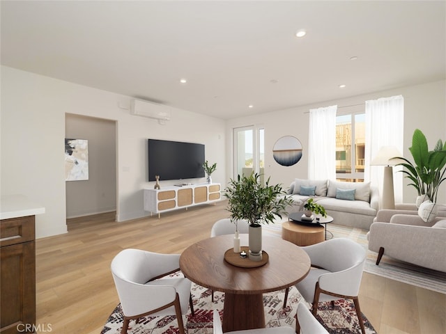 living room featuring recessed lighting, light wood finished floors, an AC wall unit, and baseboards