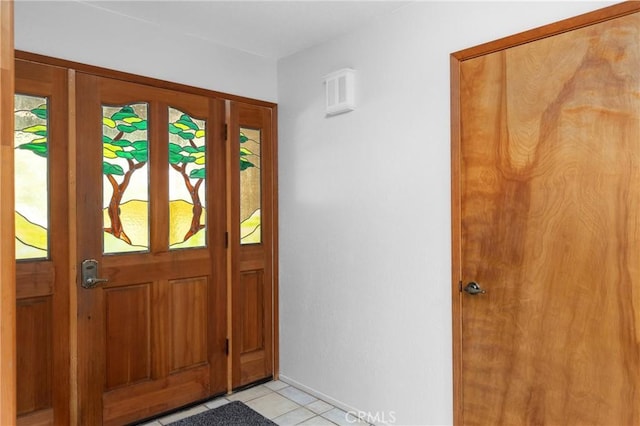 foyer entrance featuring light tile patterned floors