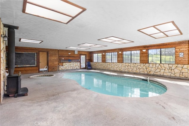 view of swimming pool with a wood stove