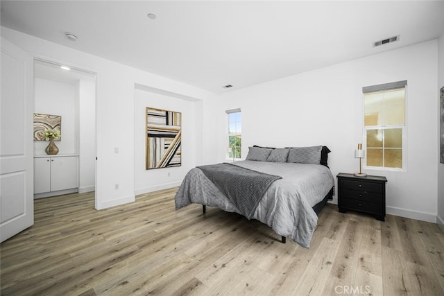 3242 Harmona Pl, Los Alamitos, CA 90720 - bedroom featuring baseboards, visible vents, and light wood finished floors