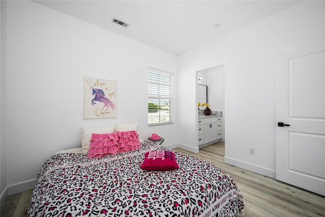 3242 Harmona Pl, Los Alamitos, CA 90720 - bedroom featuring baseboards, light wood-type flooring, and visible vents