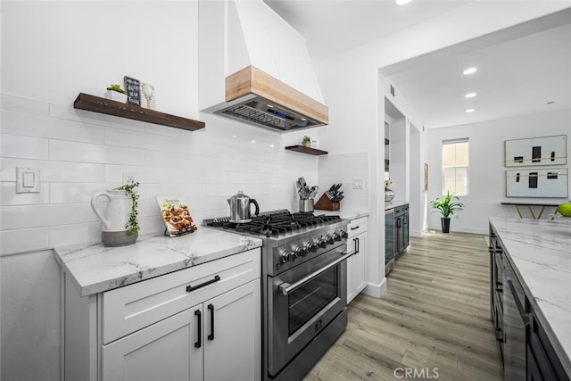 3242 Harmona Pl, Los Alamitos, CA 90720 - kitchen with high end stove, open shelves, custom exhaust hood, and light stone counters