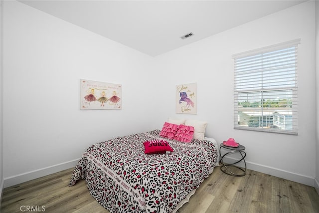 3242 Harmona Pl, Los Alamitos, CA 90720 - bedroom featuring baseboards, visible vents, and wood finished floors