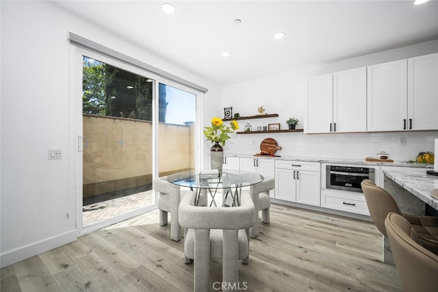 3242 Harmona Pl, Los Alamitos, CA 90720 - kitchen featuring white cabinets, open shelves, light wood finished floors, stainless steel oven, and recessed lighting