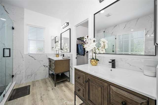 3242 Harmona Pl, Los Alamitos, CA 90720 - bathroom featuring visible vents, a sink, and a marble finish shower