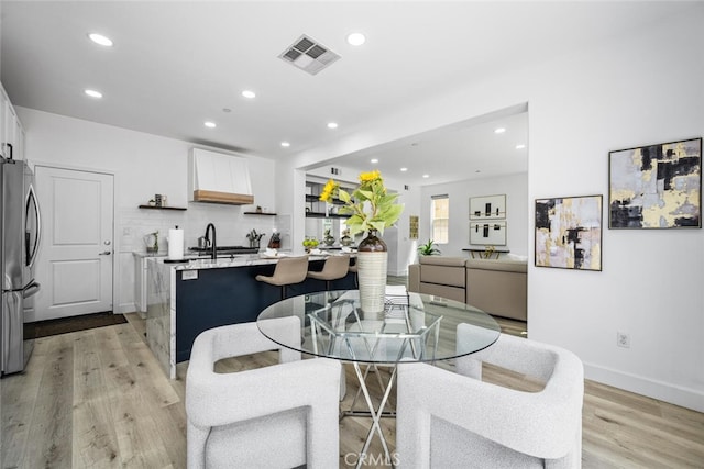 3242 Harmona Pl, Los Alamitos, CA 90720 - dining room featuring visible vents, recessed lighting, light wood-style floors, and baseboards