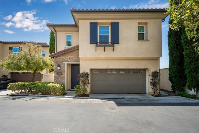 3242 Harmona Pl, Los Alamitos, CA 90720 - view of front of property featuring a garage, driveway, and stucco siding