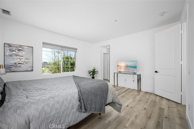 3242 Harmona Pl, Los Alamitos, CA 90720 - bedroom featuring baseboards, visible vents, and wood finished floors